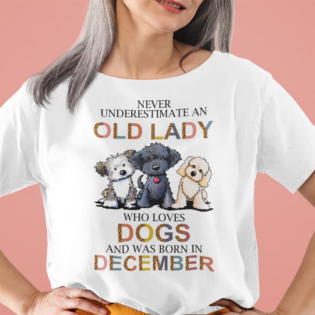 Never Underestimate An Old Lady Who Loves Dogs Shirt December.jpg