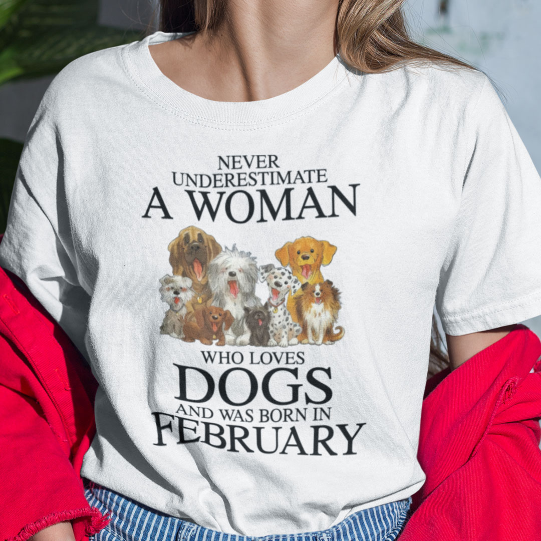 Never Underestimate Woman Loves Dogs Born In February Shirt.jpg