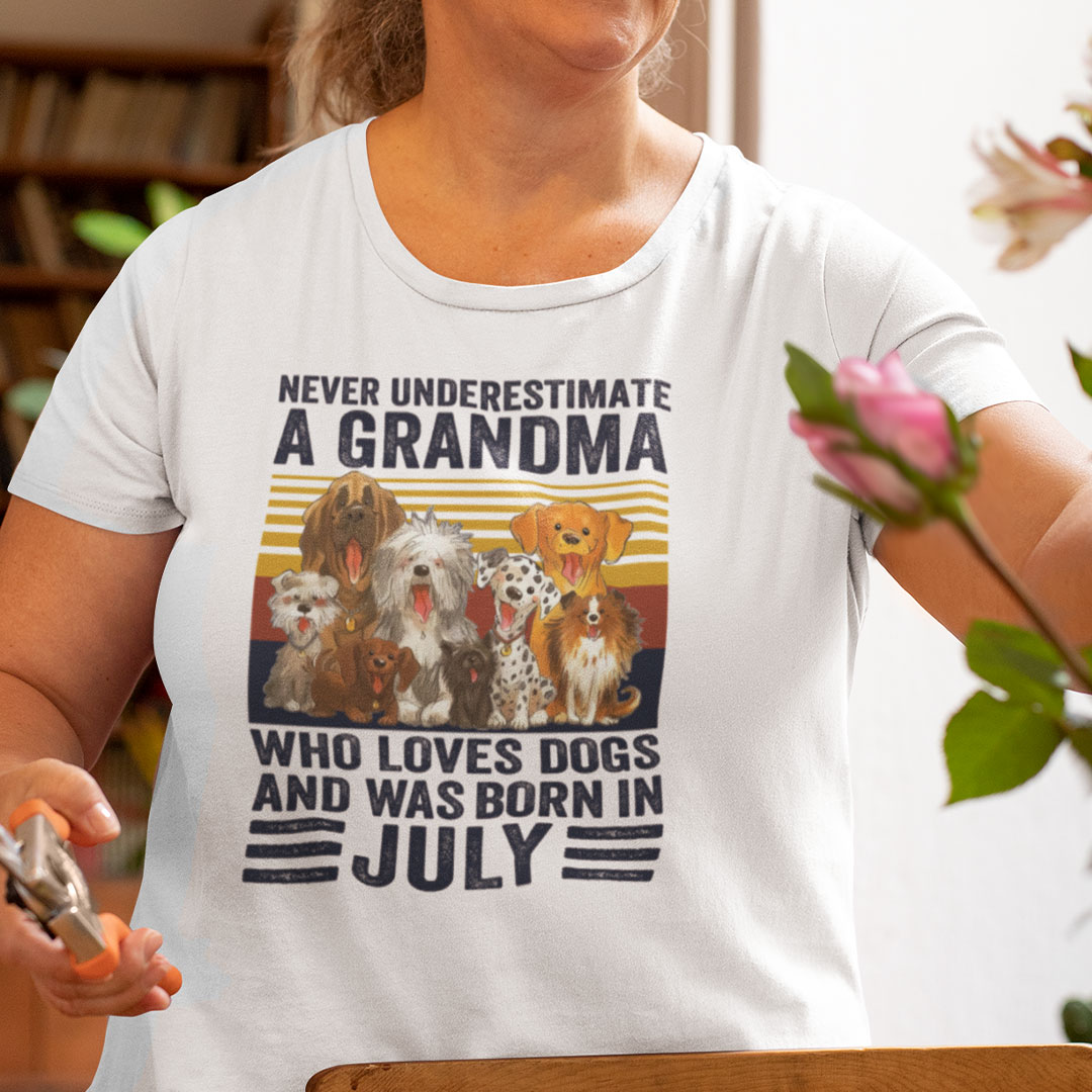 Never Underestimate A Grandma Who Loves Dogs July Shirt.jpg