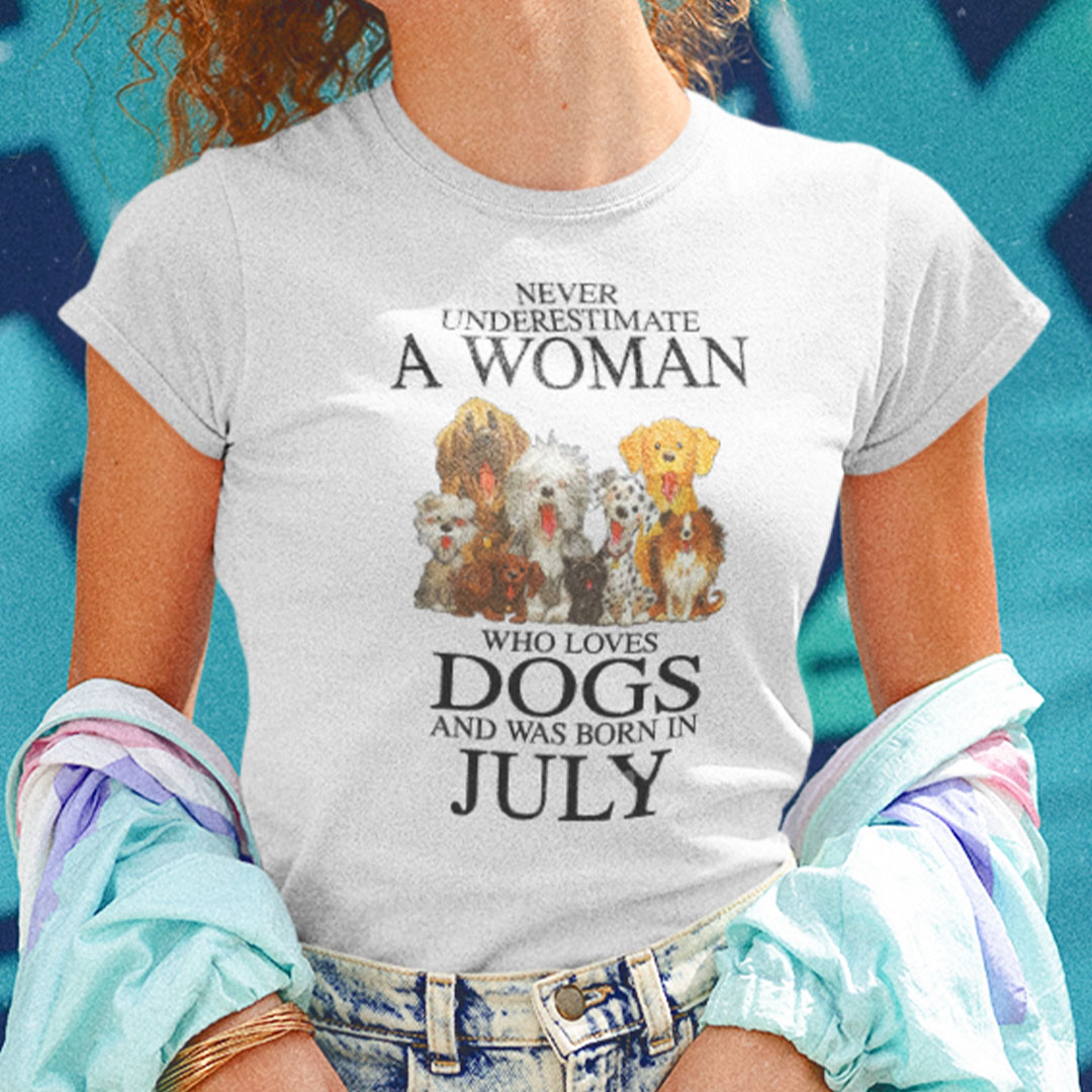 Never Underestimate Woman Loves Dogs Born In July Shirt.jpg