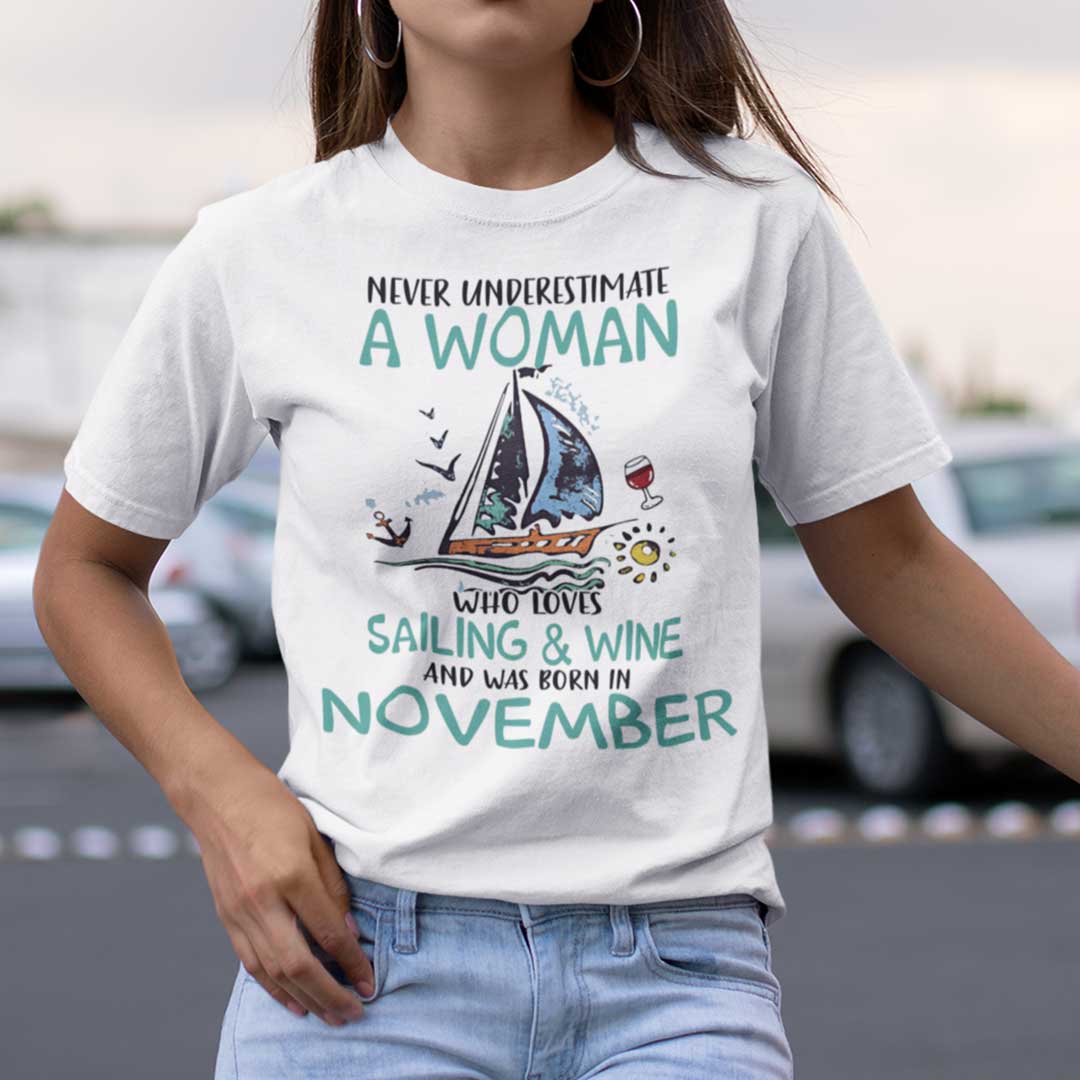 Never Underestimate A Woman Who Loves Sailing And Wine Shirt November.jpg