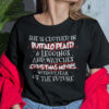 She Is Clothed In Buffalo Plaid And Leggings And Watches Christmas Movies Shirt.jpg