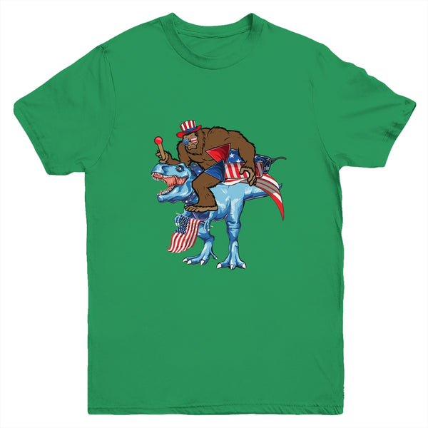 Bigfoot riding Dinosaur USA Flag 4th Of July America Youth Youth T Shirt Irish Green 600x 1.jpg