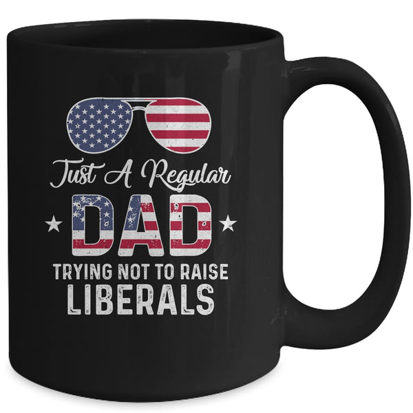 Just A Regular Dad Trying Not To Raise Liberals Republican Mug 15oz Mug Black 22b64337 d96a 4dcb b00e 9d360d010640 600x.jpg